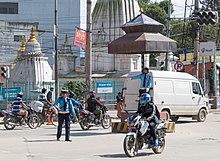 Traffic Police personnel manually direct traffic at the busiest roads and junctions. Traffic-controllers - Kathmandu, Nepal - panoramio.jpg