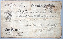 A One Guinea banknote, issued by the Gloucester Old Bank in 1813. 1813 One Guinea Gloucester Old Bank banknote.jpg