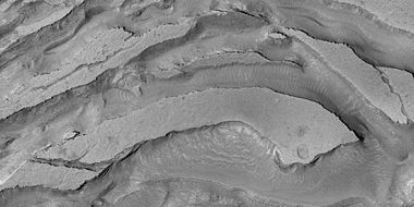 Tilted layers formed from ground collapse, as seen by HiRISE, under HiWish program