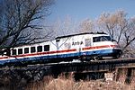 An RTL Turboliner crosses the Seneca River near Savannah, New York, in 1984.