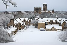 A picture of Durham School chapel in the snow with Durham Cathedral in the background