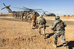 U.S. Army and Iraqi army soldiers board a Marine Corps CH-53E Super Stallion helicopter in Camp Ramadi, Iraq, 2009. Flickr - The U.S. Army - Loading up.jpg