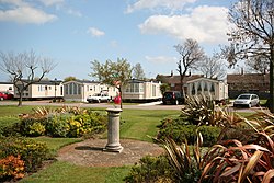 Static caravans and a small grassed area in front