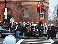 Protesters in Guy Fawkes masks take a group picture outside the Church