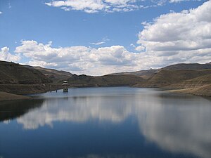 Reservoir and intake tower behind the Katse Da...