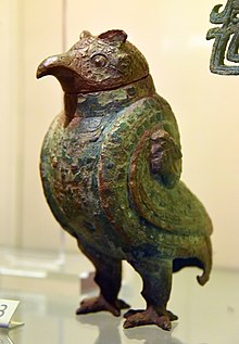 Owl-shaped wine vessel, a ritual bronze vessel called "Zun", used for storing wine in tombs. Bronze. Shang Dynasty, 1250-1050 BCE. From China. Victoria and Albert Museum, London.jpg