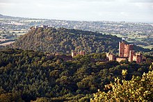 Peckforton Castle, Cheshire, with Beeston Castle in the distance Peckforton Castle from Stanner Nab.jpg