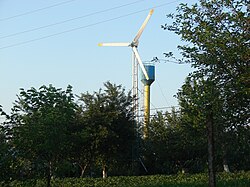 A wind turbine outside the village