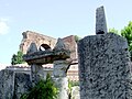 Resti della Basilica Hilariana, eretta da Manius Publicius Hilarus, dettaglio del dolmen e cippo sacrale (sullo sfondo mura romane)