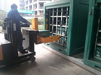 The batteries of a Zotye M300 EV being charged before being swapped.