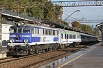 A PKP passenger train led by locomotive number EP07-374 leaves Gdańsk Główny railway station in September 2015