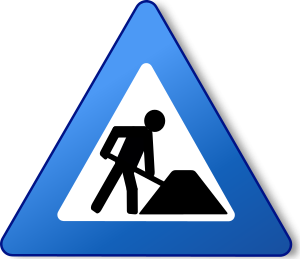A blue warning construction sign