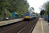 A three car Class 80 train trailed by 8085 leaves Derriaghy in 2004