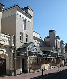 The Brighton Hippodrome's present appearance dates from 1901, when Frank Matcham altered it. Former Brighton Hippodrome, Middle Street, Brighton (IoE Code 482157).jpg