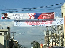 Observers generally believed that the G9 alliance was supported by Jovenel Moise and the PHTK party (banner celebrating Moise's inauguration pictured). Inauguration of Jovenel Moise 06.jpg