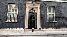 The main entrance of 10 Downing Street, the official residence and office of the First Lord of the Treasury, who is by law nowadays also the prime minister Larry the cat outside 10 Downing St.jpg