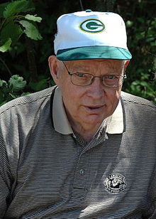 Portrait of Remmel wearing a Packers hat