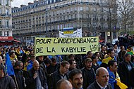 Kabyle protesters in Paris holding the Berber flag, April 2016 Nuit Debout - Paris - Kabyles - 48 mars 10.jpg