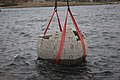 A concrete version of the logo being lowered into Lake Sevan in Armenia to create an artificial reef
