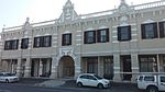 A double-storeyed house, partly altered, but retaining woodwork dating from c1830, including 2 fine 8-panelled doors with garlanded spoke-fanlights contained within rectangles. These properties form an integral part of the historical and architectural nucleus of Paarl. The houses on these erven, the majority of which date from the nineteenth century, are representative of the Cape Dutch, Georgian, Victorian and Edwardian building