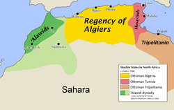 Map of North Africa. The regency of Algiers is colored in light brown and is at center top, Husaynid Tunisia is to its right and colored maroon, Tripolitania is at extreme right and colored dark brown. The core territory of the 'Alawid dynasty is at center left and colored dark green, the outlying territories of the dynasty are colored light green. Important cities and the Sahara Desert are marked.