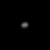 A blurry ellipsoidal object in the center of the image