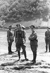 General Erwin Rommel and staff observe 7th Panzer Division practicing a river crossing at the Mosel, 1940 Bundesarchiv Bild 101I-124-0242-24, Mosel, Julius v. Bernuth, Erwin Rommel.jpg