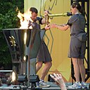 ☎∈ The Olympic flame being transferred into a lantern for ceremonious safe-keeping overnight during the in Cambridge leg of the 2012 Summer Olympics torch relay.