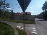 Cartéllo bilìngoe da localitæ de Cudvilla