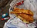 English: Fish and chips traditionally wrapped ...