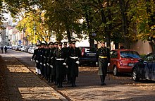 Lithuanian Army soldiers marching with their dress uniforms in Vilnius. An officer stands out with a sword. Lithuanian army in Vilnius (8123251773).jpg