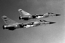 A pair of French Air Force Mirage F1Cs from the EC 2/30 and EC 3/30 in flight, 31 May 1986. Two French air force Dassault Mirage F1C aircraft.jpg