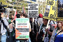 Demonstrators holding various signs 93.FreePalestineRally.WDC.4November2023 (53320282865).jpg