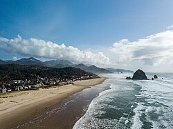 An aerial view of Cannon Beach with Haystack Rock in the background