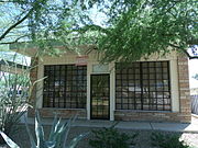 This historic building once housed "Peoples Drug Store". This structure was built c. 1940's and was originally located at 111 East Dunlap Ave. Pharmacist Bob Rice established his pharmacy there and in 1953 installed what was the first pharmacy drive through window in Arizona and the fifth in all the nation. The building was moved in 1999, to 737 E. Hatcher Road, Phoenix its current location and currently is the home of the Sunnyslope Historical Society and Museum.