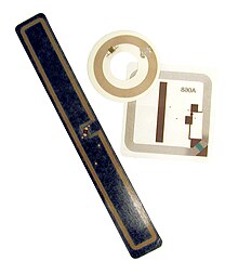 RFID tags used in libraries: square book tag, round CD/DVD tag and rectangular VHS tag RFID Tags.jpg