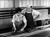 Charlie Chaplin in a scene from the film Modern Times (1936)