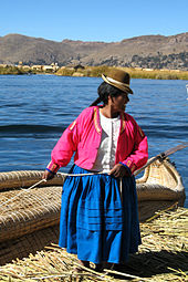 A Uro woman on a floating islet on Lake Titicaca.