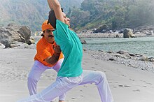 Practitioners can use yoga asanas such as Virabhadrasana I as an opportunity to observe their thoughts and sensations. Yoga Therapy teacher training course.jpg