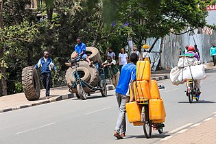 A man drives a wheelchair Photo by Emmanuelkwizera