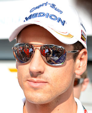 Force India driver Adrian Sutil signs autograp...