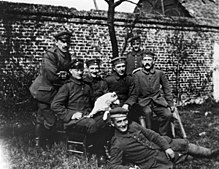 Hitler sitting at far right among soldiers of the "List" regiment and Fuchsl Bundesarchiv Bild 146-1974-082-44, Adolf Hitler im Ersten Weltkrieg.jpg