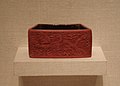 A small red lacquerware container for crickets, design of a dragon on the side, from the reign of the Jiajing Emperor (1521-1567 AD)