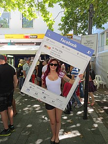 Human billboard at the National Multicultural Festival being used to advertise Facebook news feed Facebook advertising.jpg