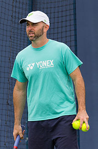 Jamie Delgado coaching Gilles Müller during practice at the Queens Club Aegon Championships in London, England.