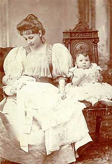 Penelope Delta, age 33, holding her baby daughter