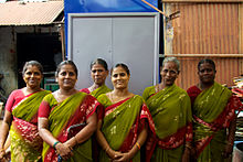 Women operating a cabinet manufacturing business, India SHG women running a cabinet manufacturing business (5103677355).jpg