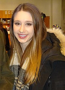 Farmiga speaking on stage at the Toronto premiere of The Final Girls