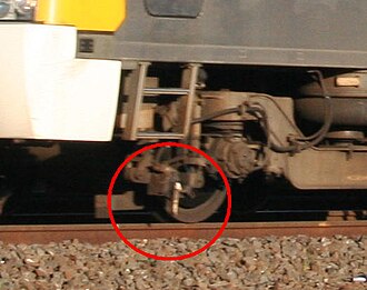 Train-mounted trip cock, located on the leading bogie of a Siemens EMU Train-trip-lever.jpg