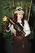 Girl wearing steampunk costume, including goggles and pith helmet